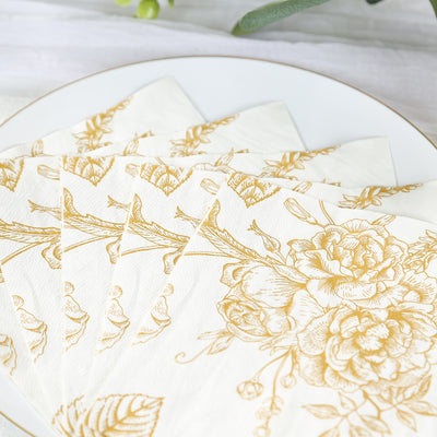 Elegant floral patterned napkins on a white plate.