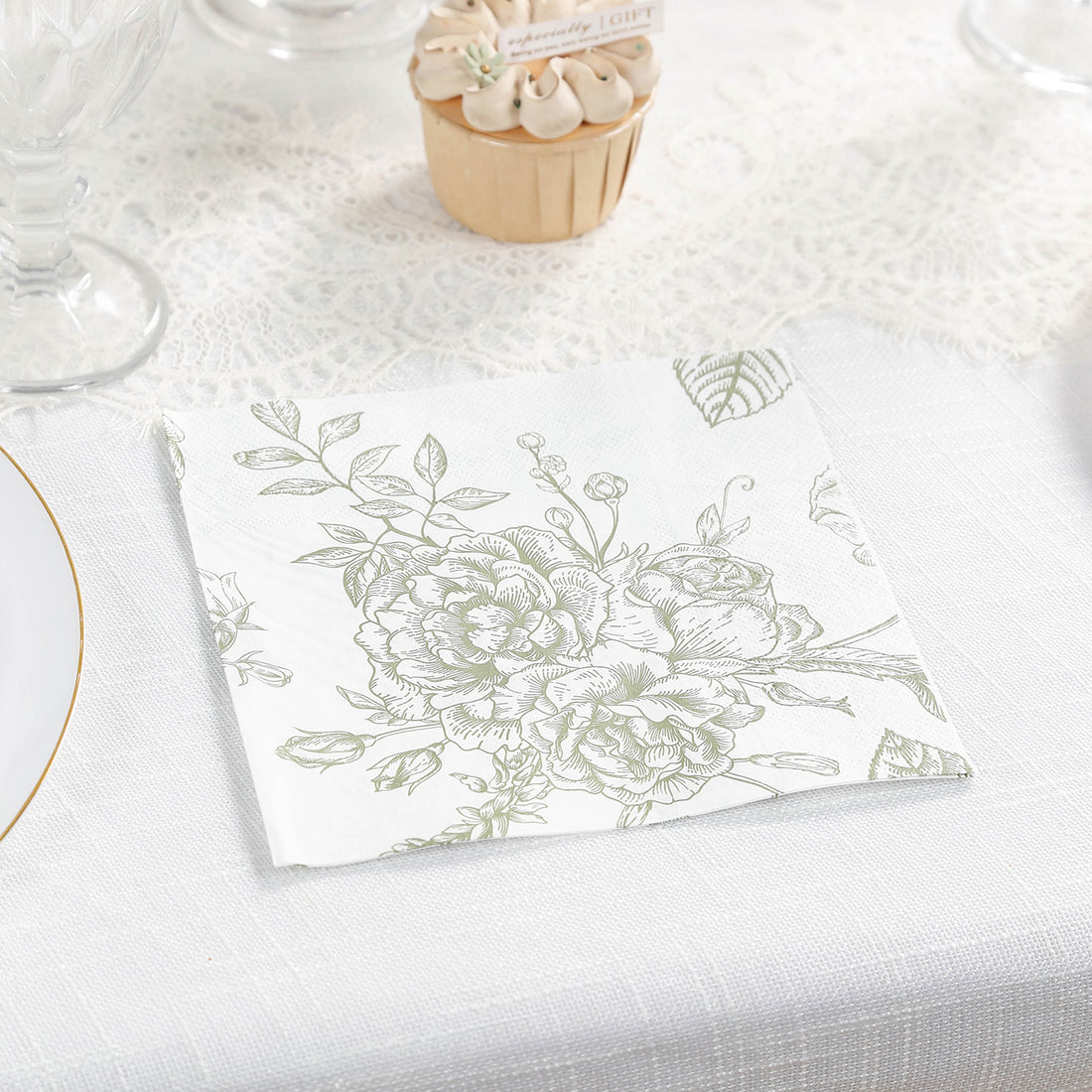 Floral patterned napkin on a textured table setting.