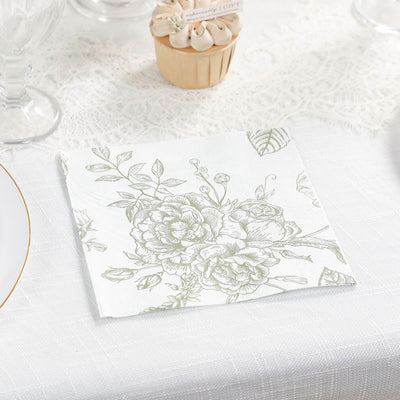 Floral patterned napkin on a textured table setting.