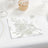 Floral patterned napkin on a textured table setting.
