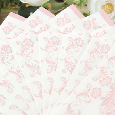 Pink floral patterned napkins arranged in a fan shape.