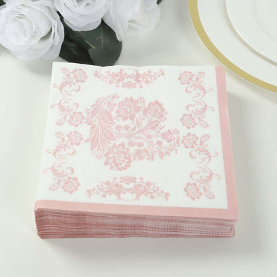 Elegant pink floral paper napkins stacked on a white background.