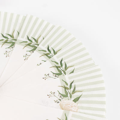 Decorative paper napkins with floral design and green stripes on a white background
