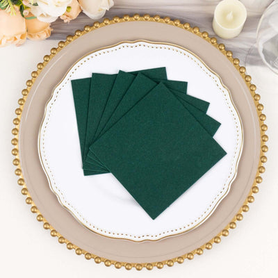 Green paper coasters arranged on a decorative plate.