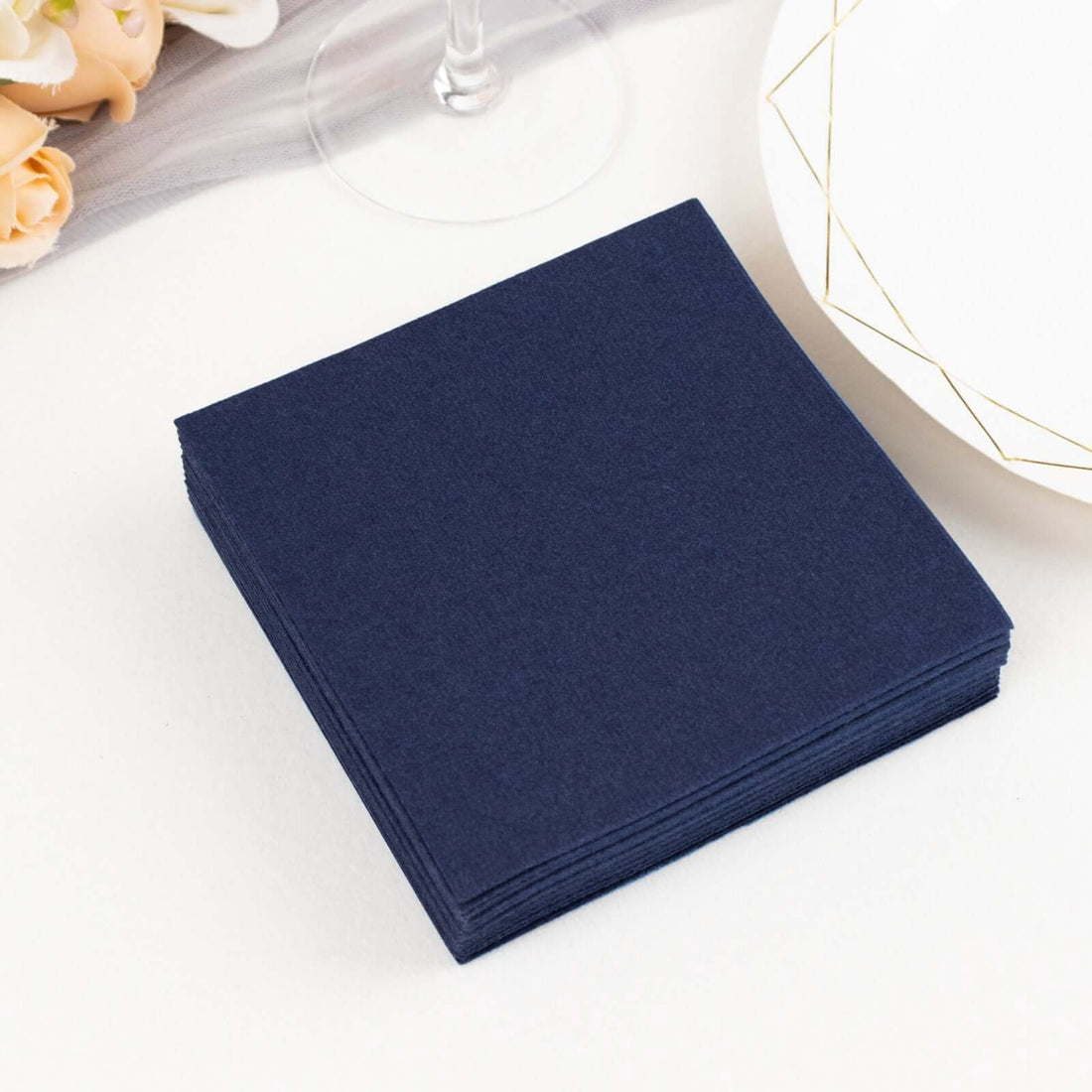 Navy blue napkins stacked neatly on a table
