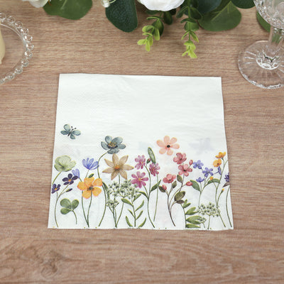 Floral print napkin with colorful flowers on a white background.