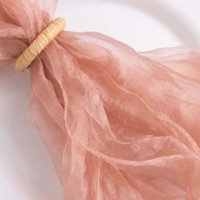 Peach organza ribbon tied with a natural straw ring