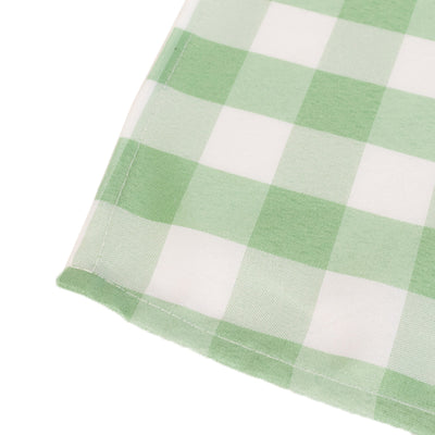 Green gingham patterned fabric corner close-up shot.