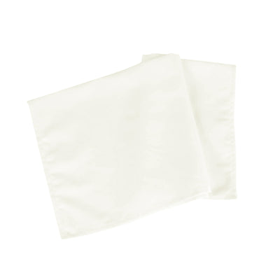 White fabric napkins neatly folded on a plain background