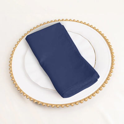 Navy blue napkin on a decorative plate