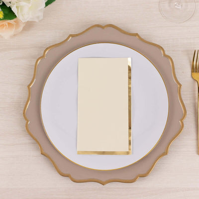 Elegant blank invitation card with gold foil edges on a decorative plate.