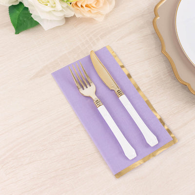 Elegant white handle cutlery set on a lavender napkin