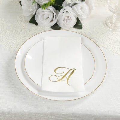 Elegant table setting with a gold monogram napkin on a white plate.