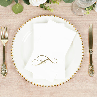 Elegant table setting with gold-accented plate and folded napkin.