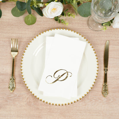 Elegant gold-accented dinner plate setting with floral decor and napkin.