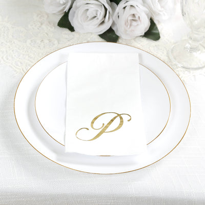 Elegant white plate with gold trim and personalized napkin featuring a gold "P".
