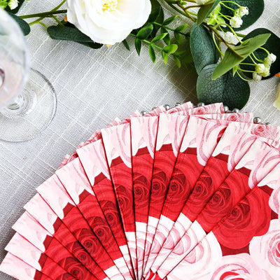 Red rose patterned napkins arranged elegantly on a table.