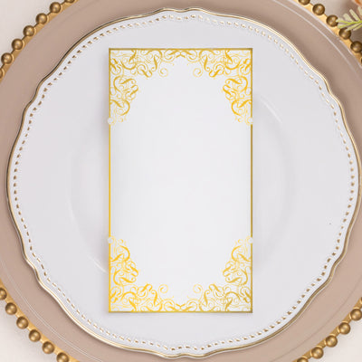 Elegant white menu card with gold floral border on a decorative plate.