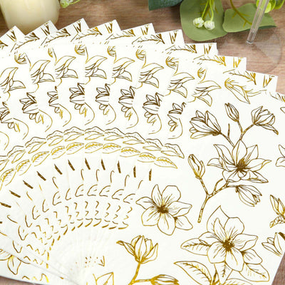 Floral patterned paper napkins in gold and white arrangement