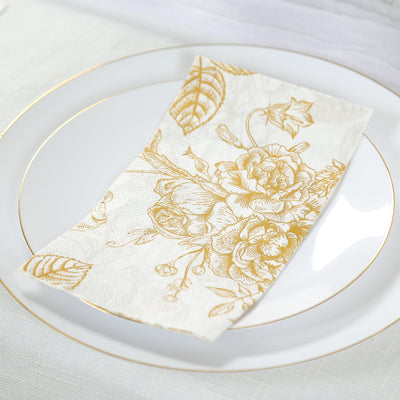 Floral gold-patterned napkin on an elegant white plate