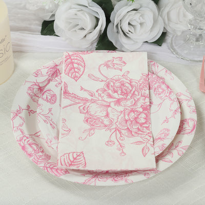 Floral patterned plates and napkins arranged elegantly on a table.