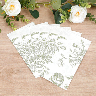 Floral patterned stationery set on a wooden surface.