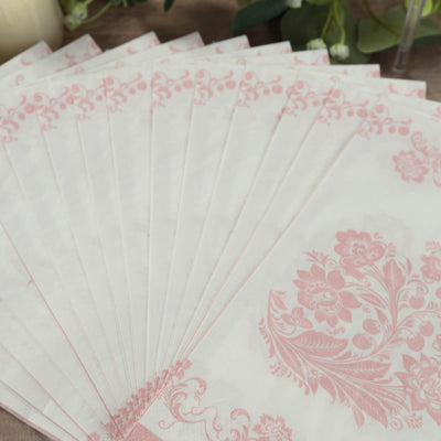 Floral-patterned napkins in soft pink and white, neatly arranged.
