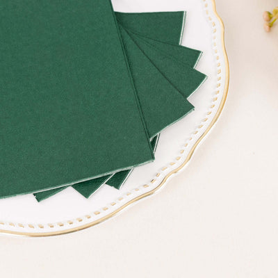 Green cardstock sheets stacked on an elegant plate.