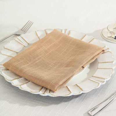 Beige linen napkin on a decorative plate setting