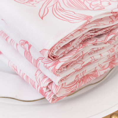 Stack of floral-patterned napkins in pink and white.