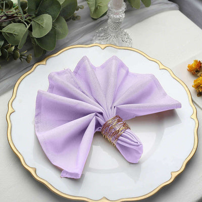 Lavender napkin elegantly arranged on a decorative plate.