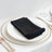 Black napkin neatly folded on an elegant plate with silver cutlery