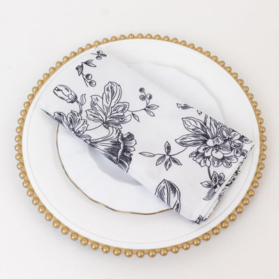 Floral patterned napkin elegantly displayed on a decorative plate