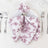 Floral printed folded napkin with silver ring on elegant table setting