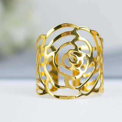 Gold rose cuff bracelet with intricate cutout design.