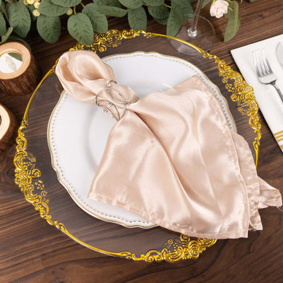 Elegant satin napkin with ring on decorative plate, styled for dining.