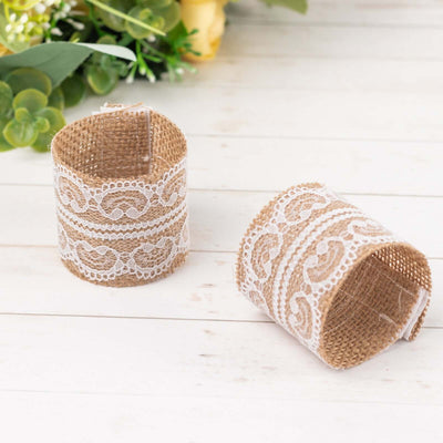 Burlap and lace rustic wedding decor elements on a wooden surface.