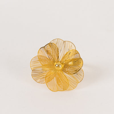 Gold wire floral brooch with intricate design and a central bead detail