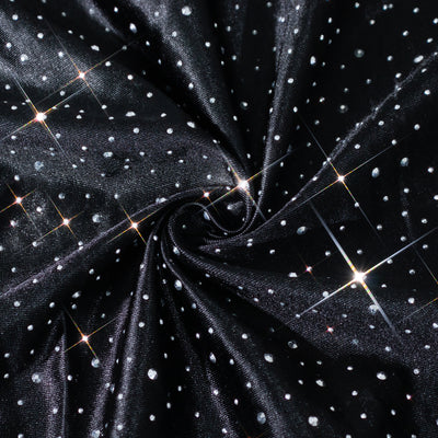 Black fabric with sparkly silver dots, showcasing a shimmering texture. #whtbkgd