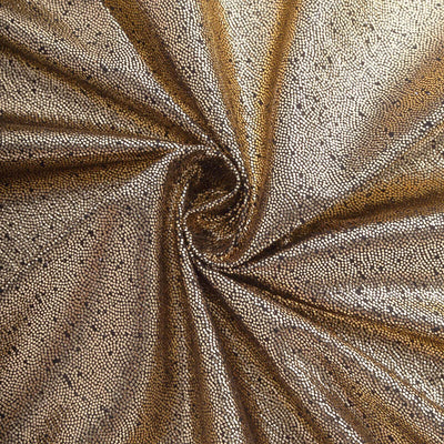Gold textured fabric with a shimmering finish.