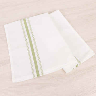 White kitchen towels with green stripes, neatly folded on a light wooden surface.