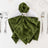 Green velvet folded napkin with silver napkin ring on elegant table setting