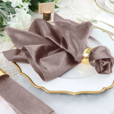 Elegant brown velvet napkin styled on a decorative plate.