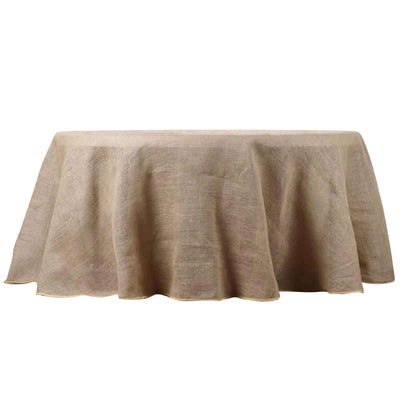 Linen tablecloth with a scalloped edge on a plain background