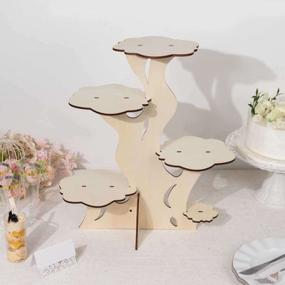 Wooden tree-shaped dessert stand with four tiers for displaying treats.