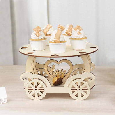 Wooden cupcake stand with decorative heart design and mini cupcakes.