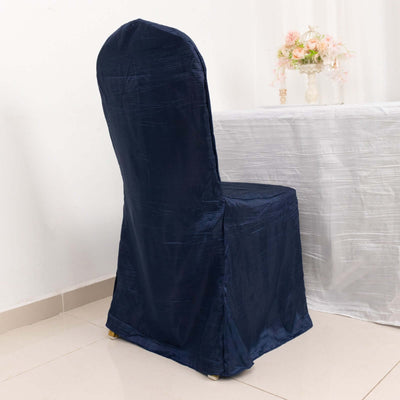 Navy blue chair cover on a dining chair, styled for an elegant setting.