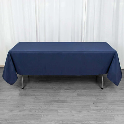 Navy blue tablecloth draped over a folding table