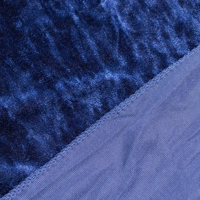Close-up of luxurious navy velvet fabric texture.