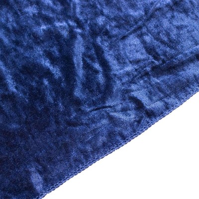 Navy blue velvet fabric close-up showcasing soft texture and sheen.